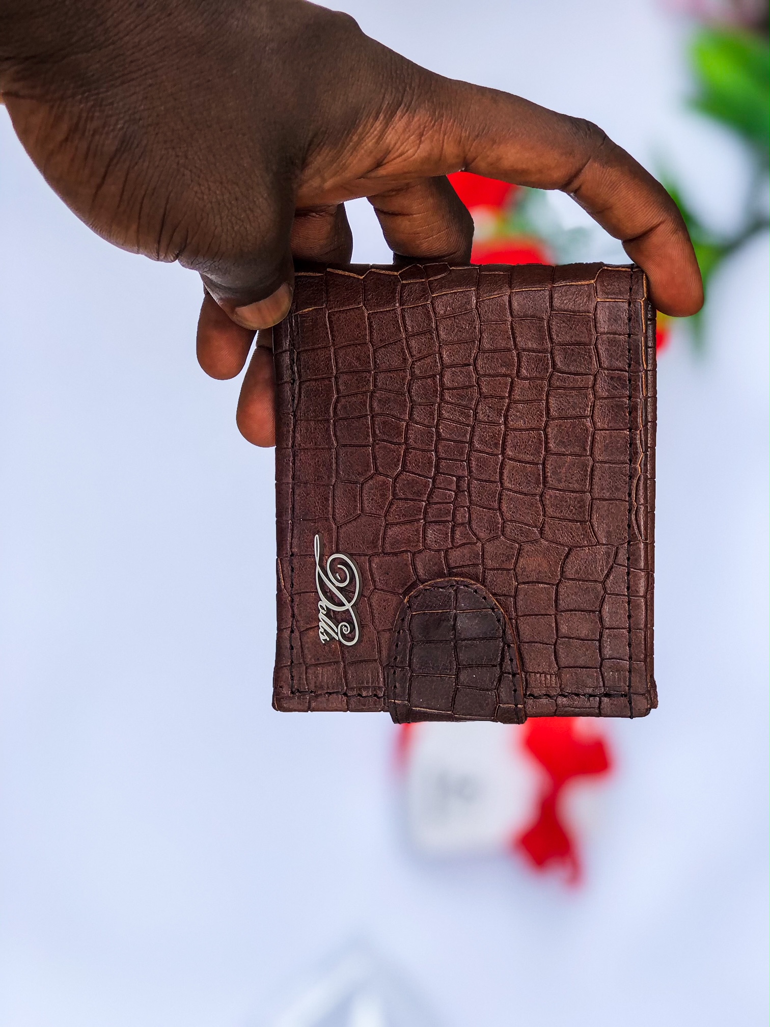 Designer wallets with button